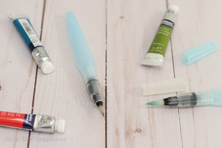 water brushes with watercolor paints