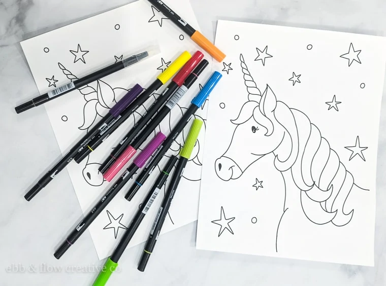 printed unicorn coloring page with markers