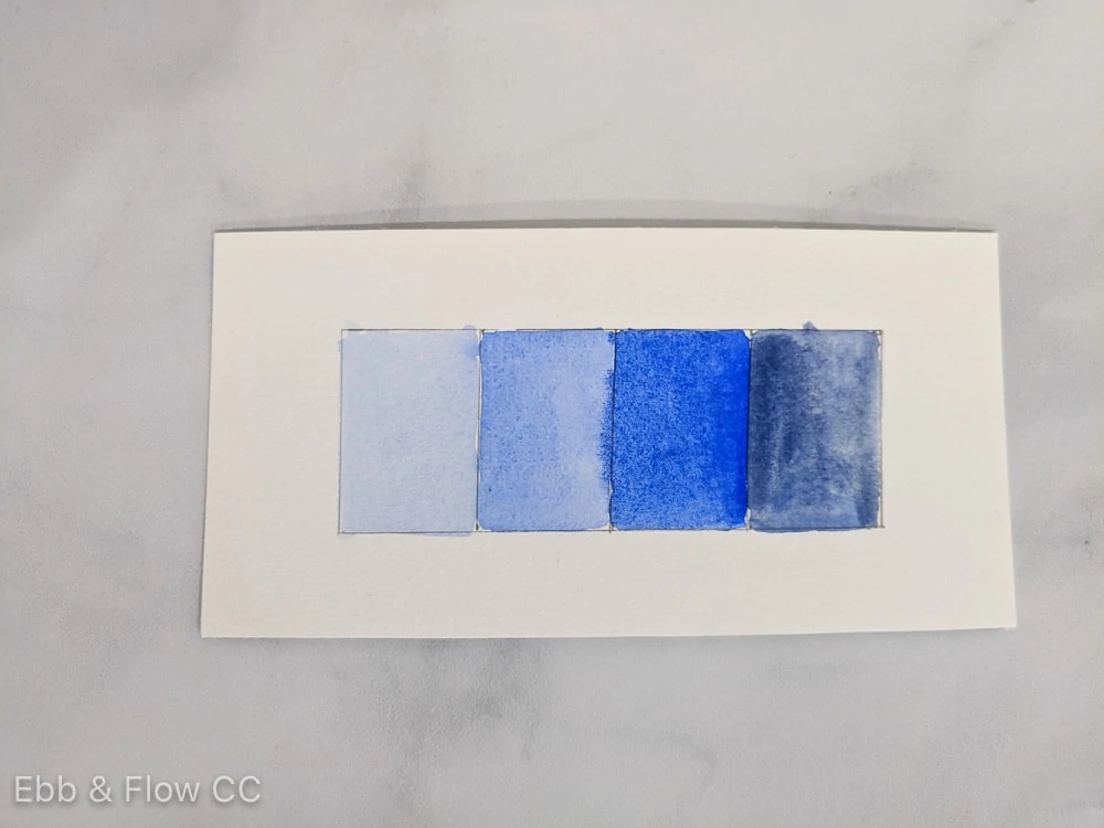 watercolor swatches showing shades and tints of blue, from light to dark