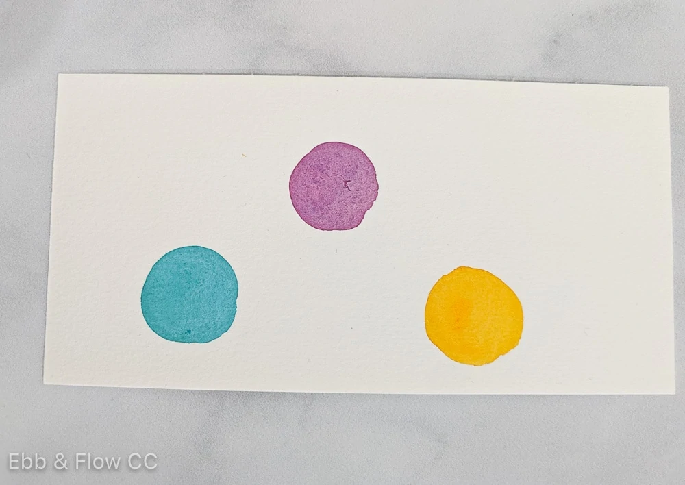 watercolor swatches of red violet, blue green and yellow orange