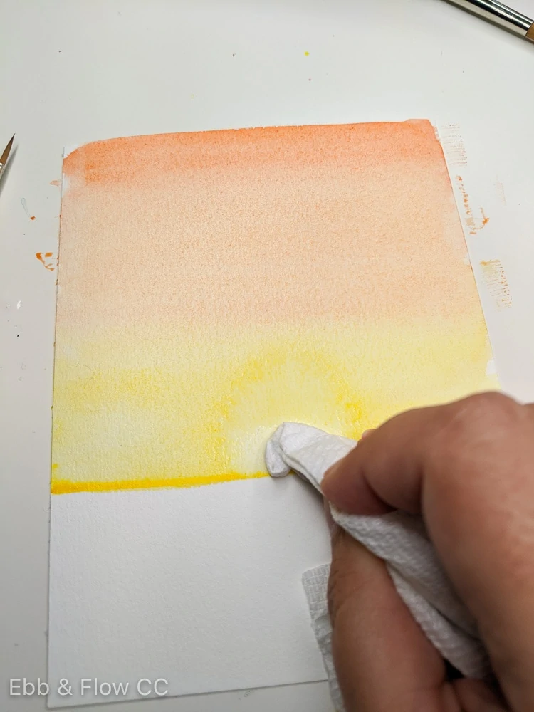 lifting watercolor paint to make a sun