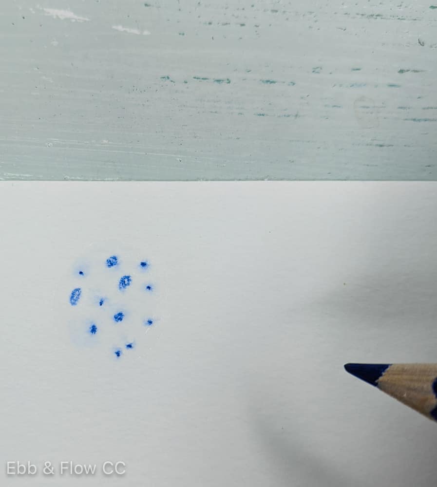 adding textured spots to wet paper