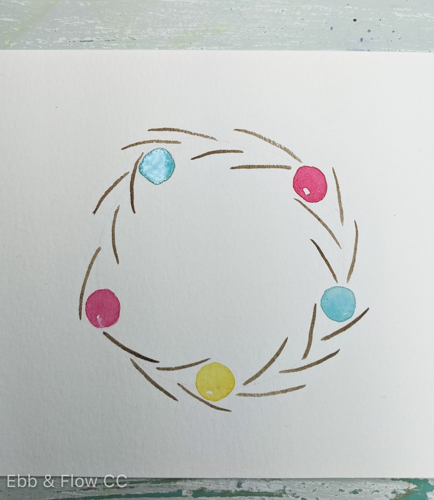 painted circles and stems on wreath base