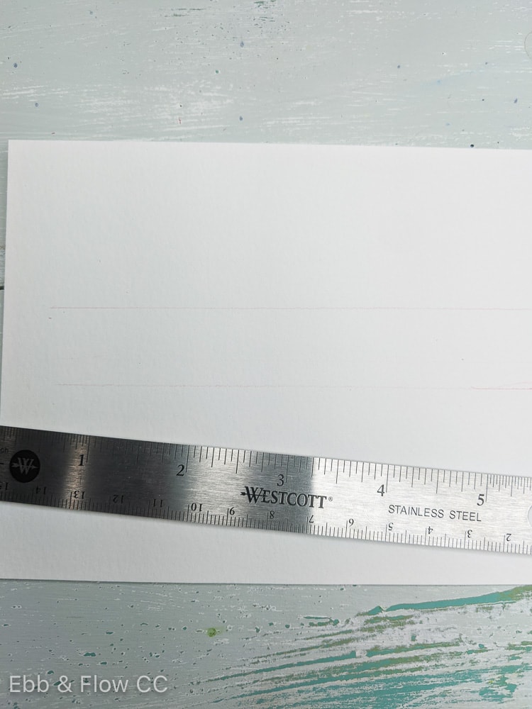 using ruler to draw guidelines for hand lettering