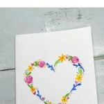 pin image - card painted with watercolors of a floral heart shape