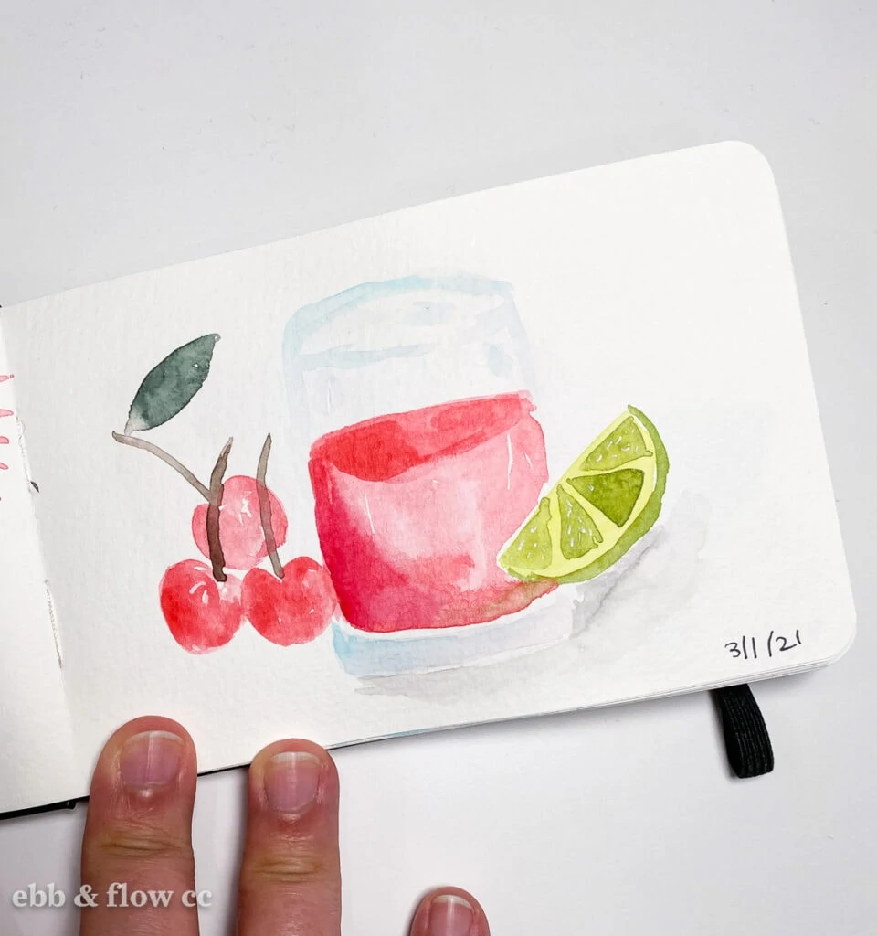 watercolor painting of glass with red drink and fruit