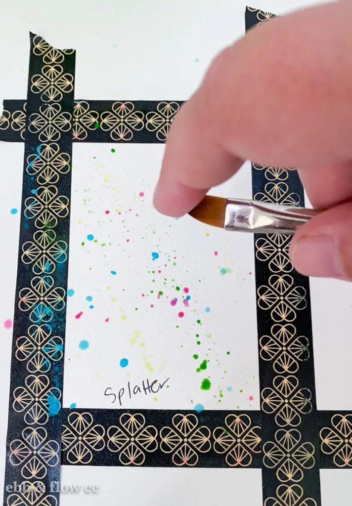 creating splatter with paint brush