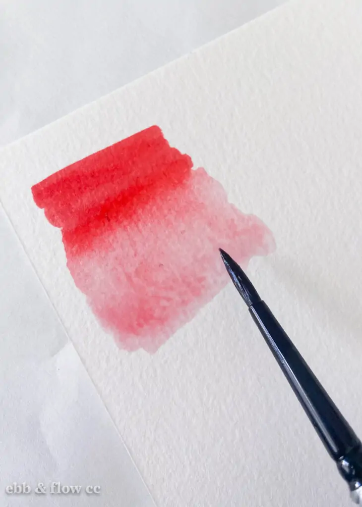 red marker swatch blended with water