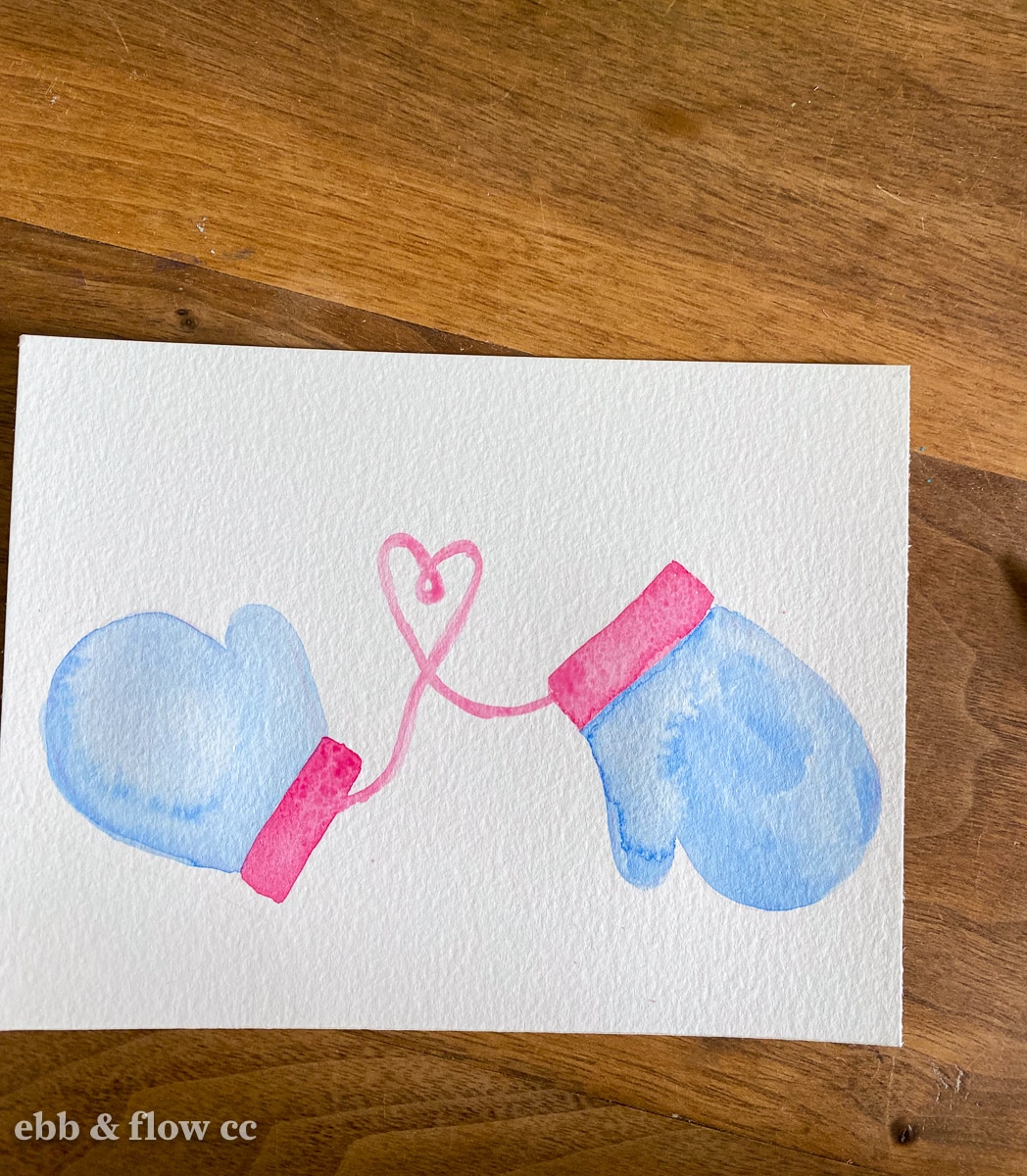 mittens connected by heart string