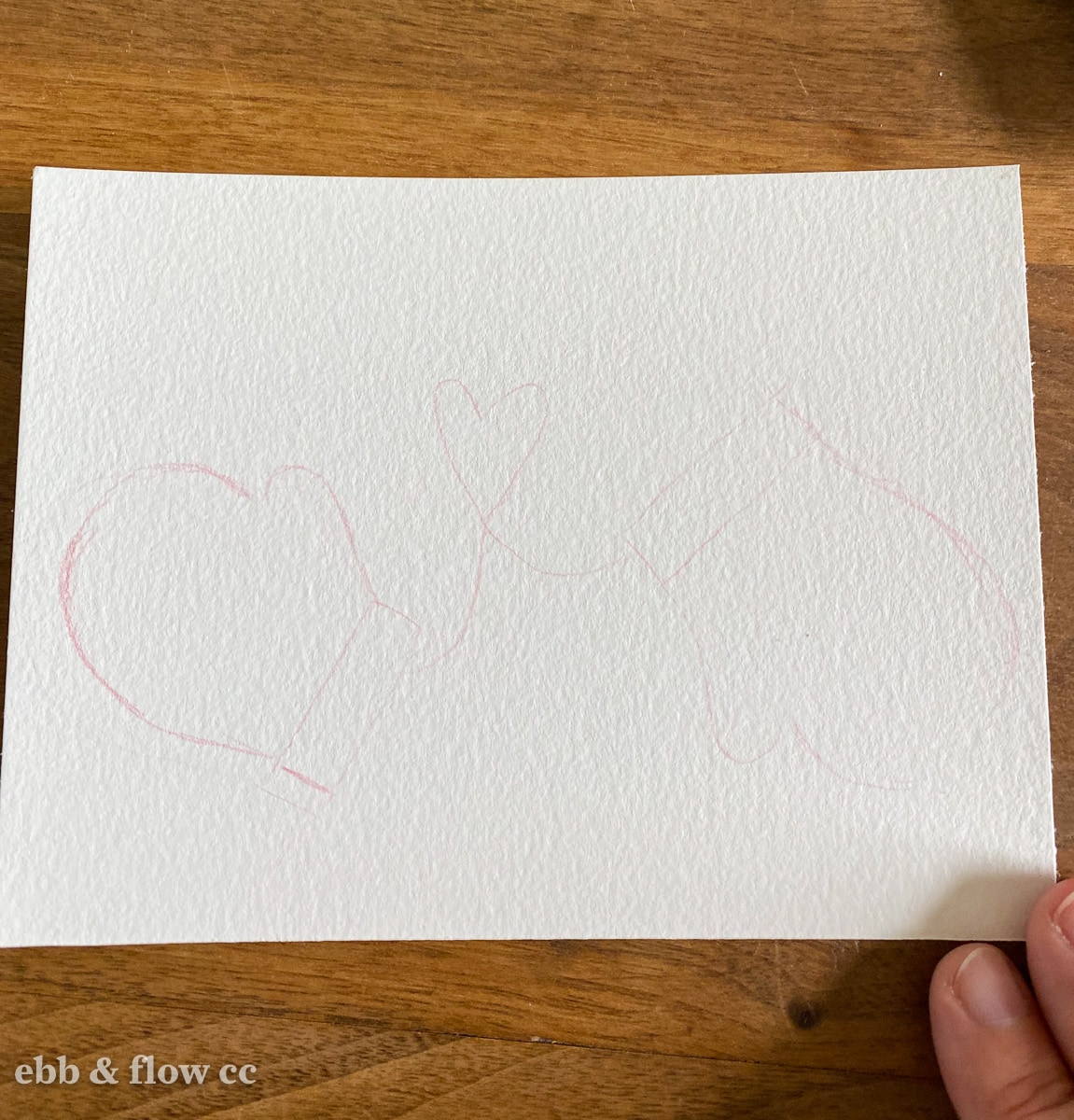 drawing of mittens on paper