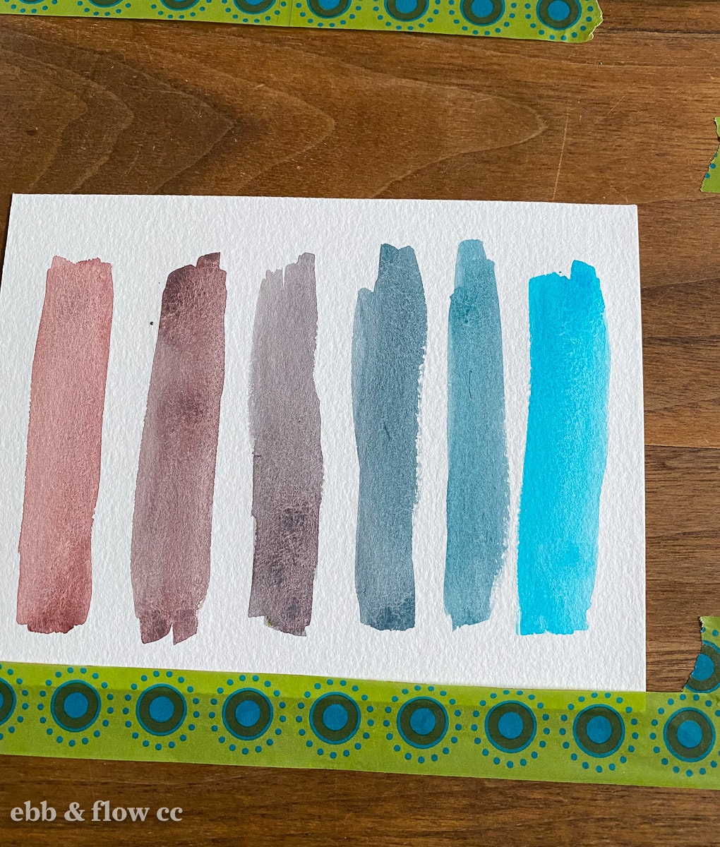 watercolor swatches in gradient from brown to teal