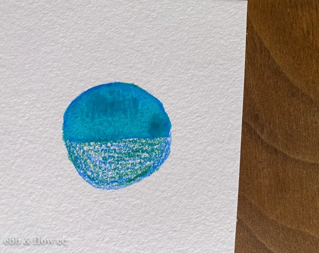 layered watercolor pencils in green and blue to make teal