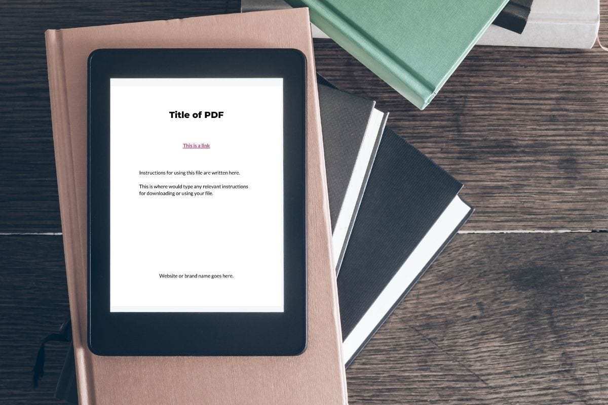 ereader showing PDF on stack of books