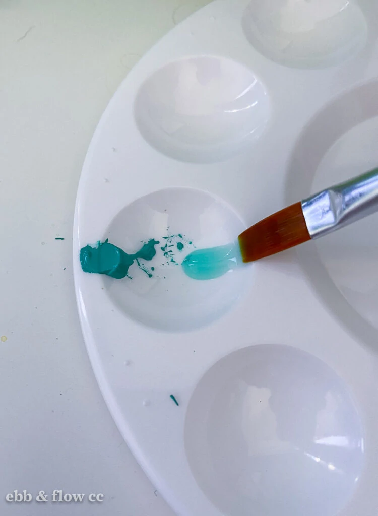 diluting teal gouache with water