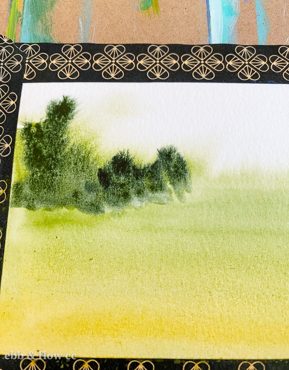 adding trees to watercolor painting