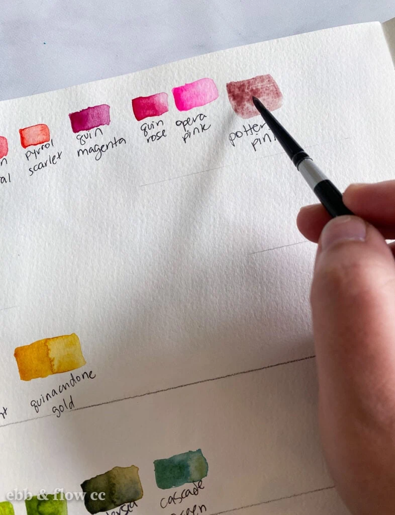 making swatches of paint colors in book