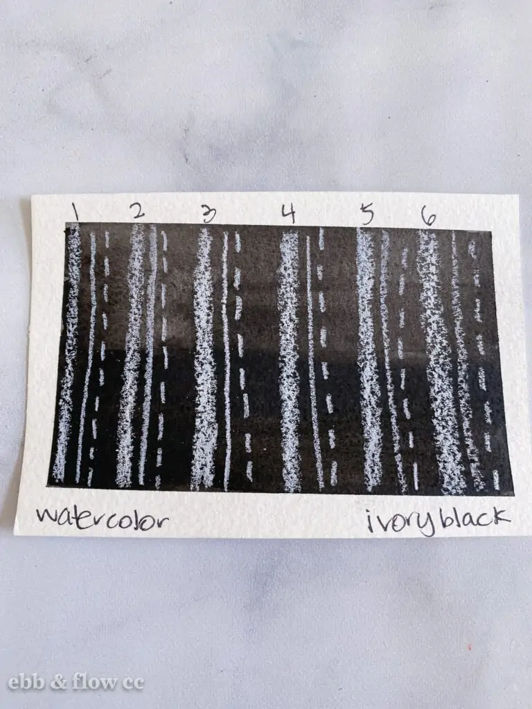 black watercolor swatch with white pencil lines