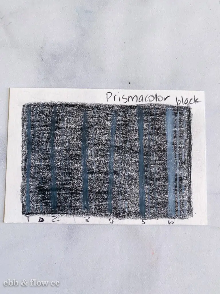 black colored pencil swatch with white pencils marks