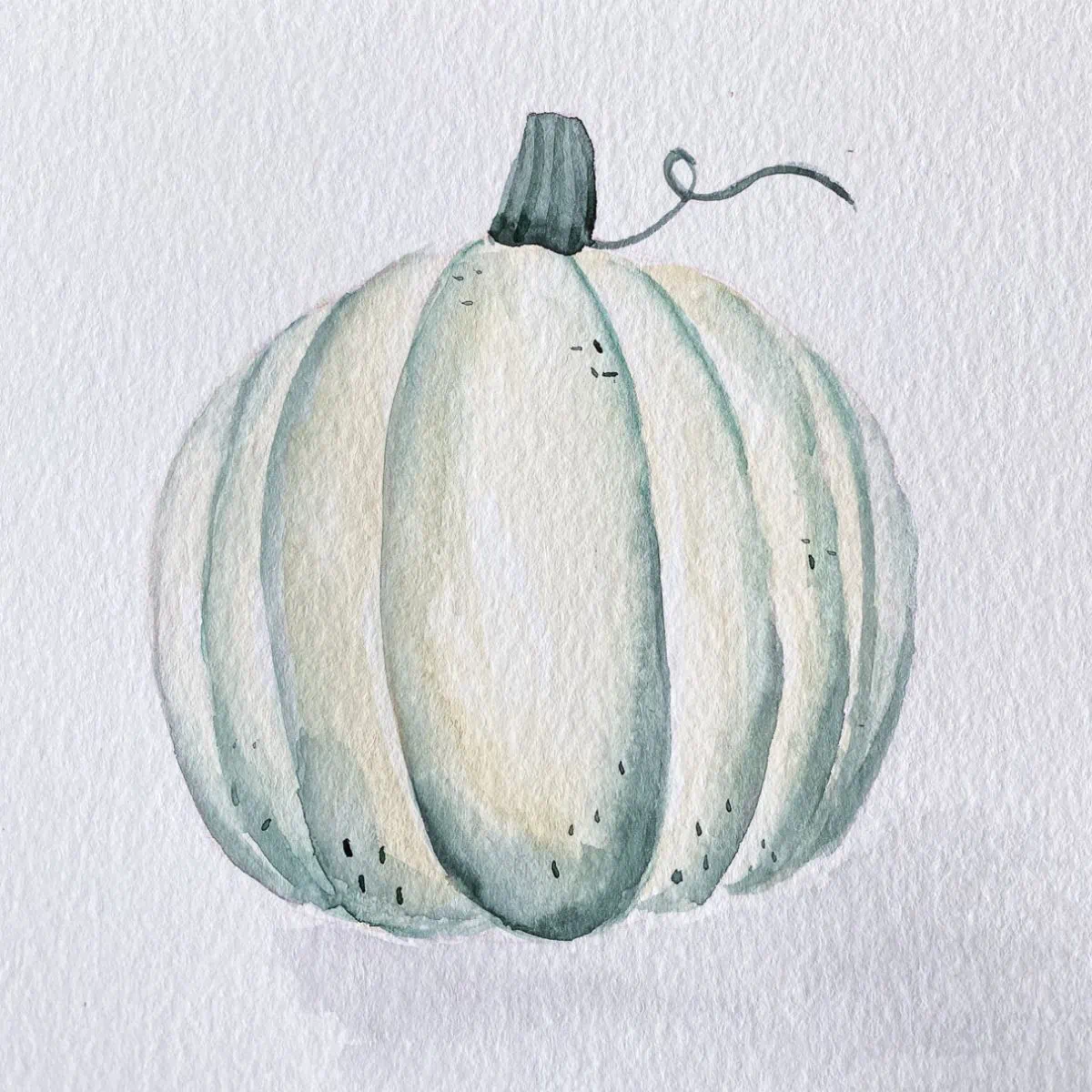 white pumpkin painted with watercolors