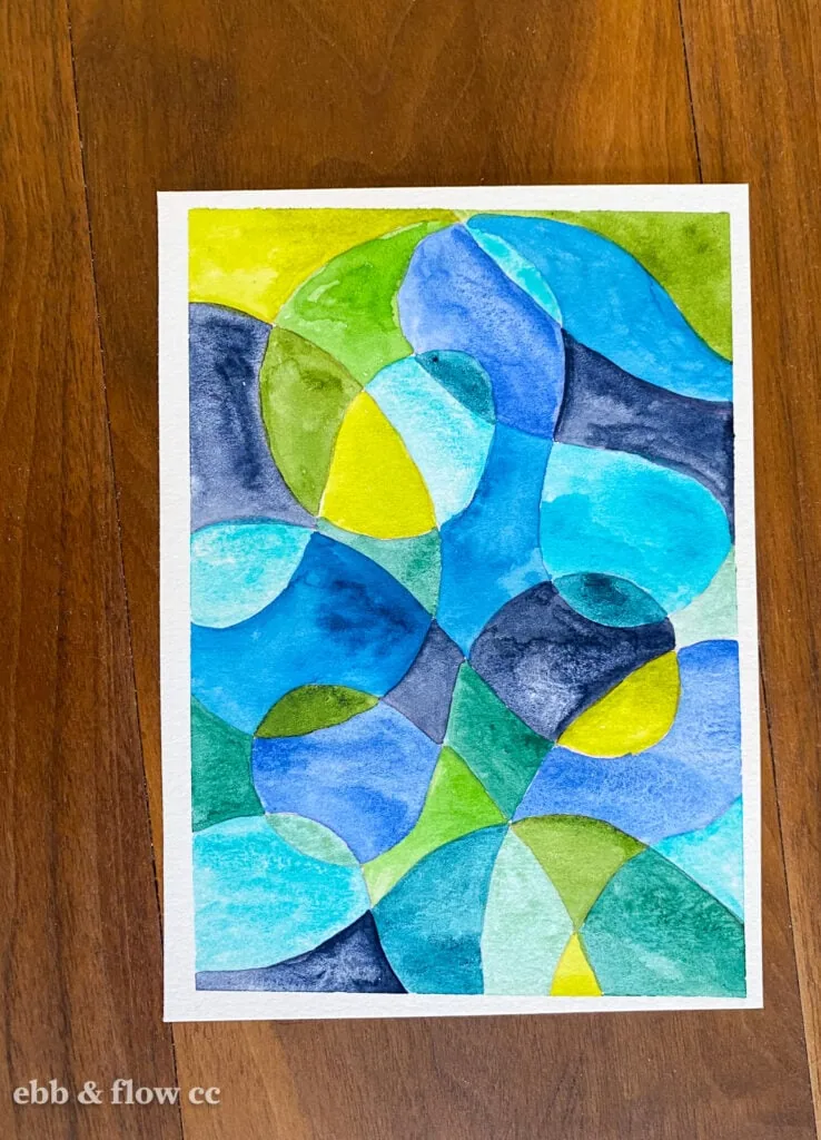 abstract watercolor painting in blues and greens