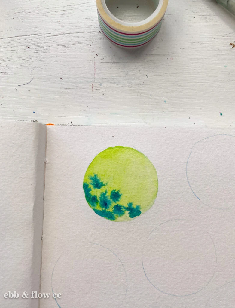 circle with watercolor paint drops