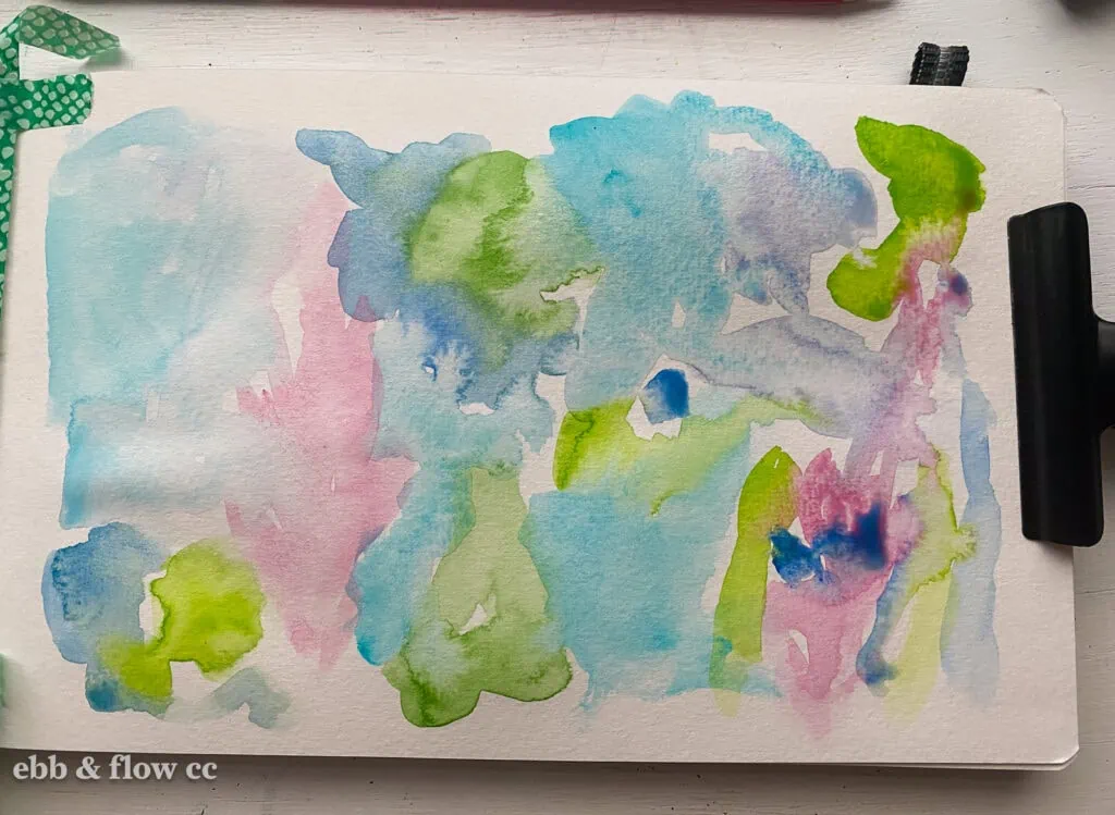 colorful watercolor splotches on paper