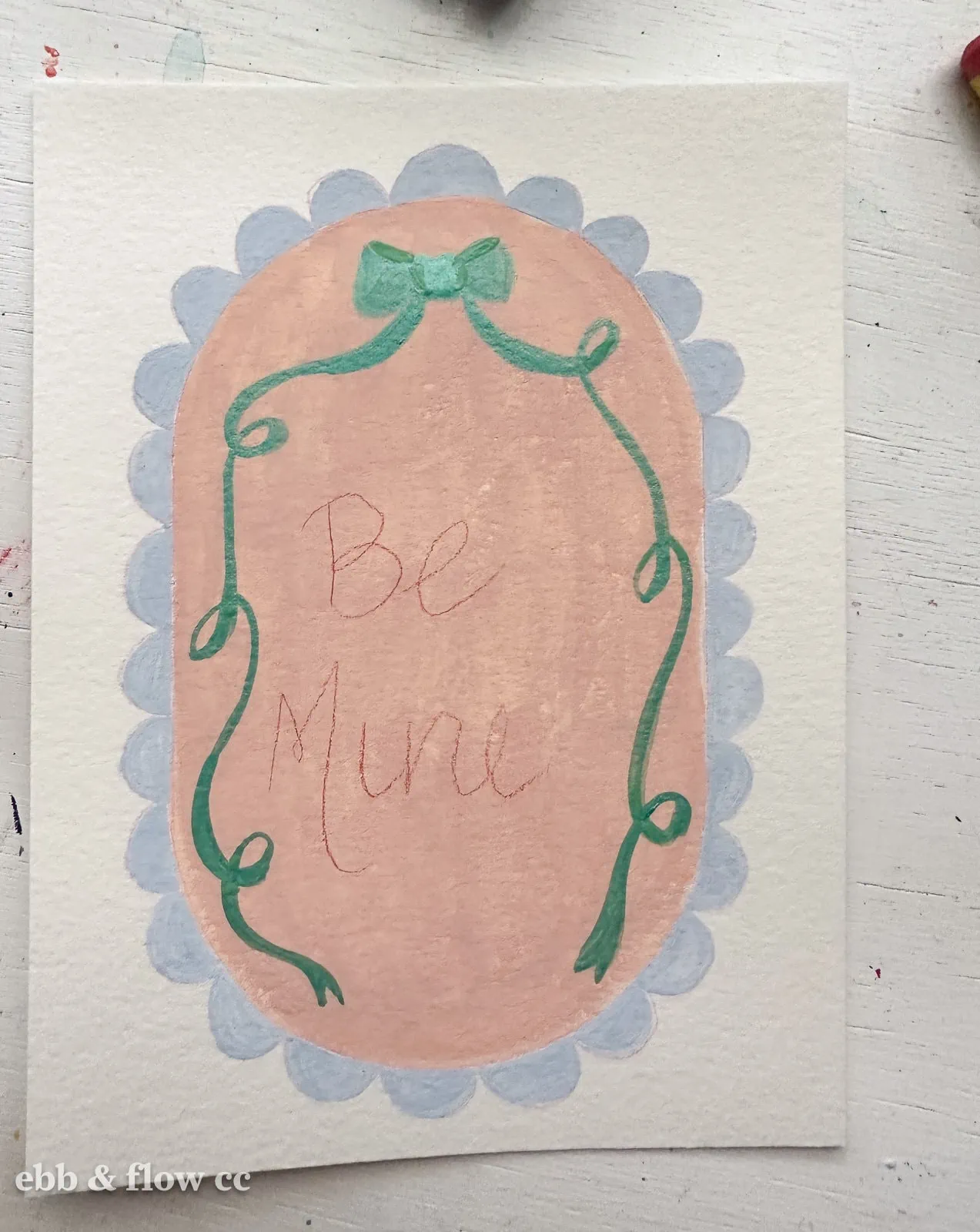 painted oval that says "Be Mine"