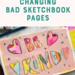 sketchbook with be kind painted in watercolor with pink acrylic background