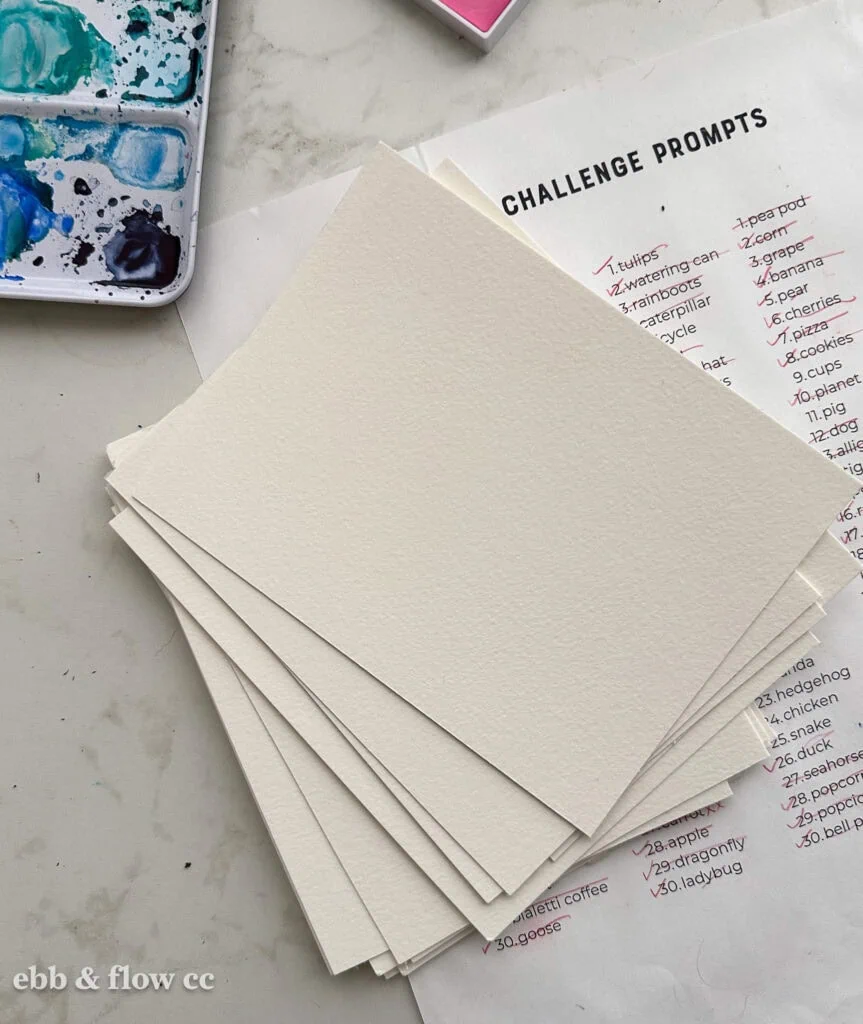 stack of cut watercolor paper pieces