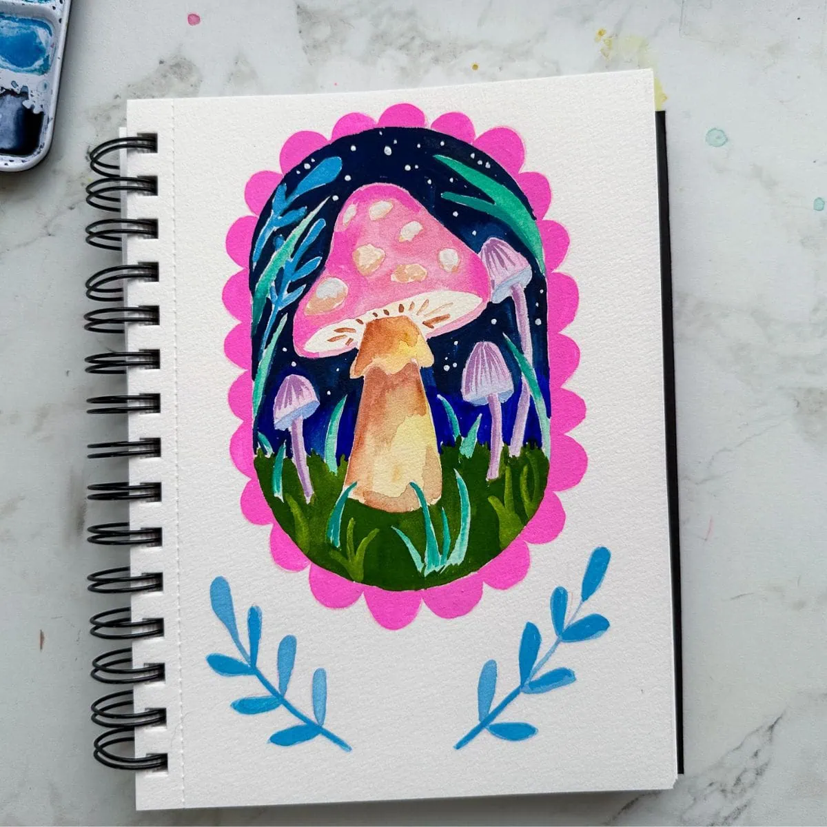 sketchbook with colorful pink mushroom painting